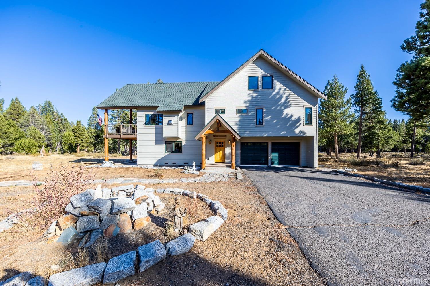 1520 Sawmill Road South Lake Tahoe, CA 96150 - Photo 1 of 27 a front view of a house with a yard