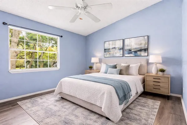 a bedroom with a bed and a window