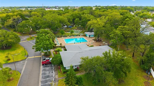 an aerial view of a house with pool outdoor seating yard and swimming pool