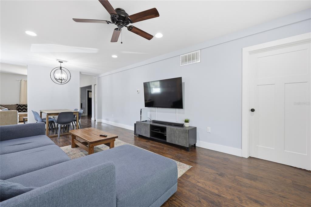 403 Northeast 9th Street Gainesville, FL 32601 - Photo 12 of 62 a living room with furniture and a flat screen tv