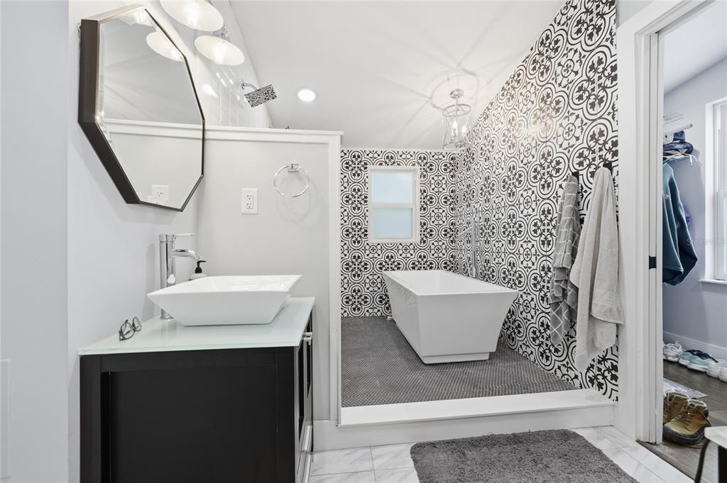 403 Northeast 9th Street Gainesville, FL 32601 - Photo 37 of 62 a bathroom with a sink a toilet and a mirror