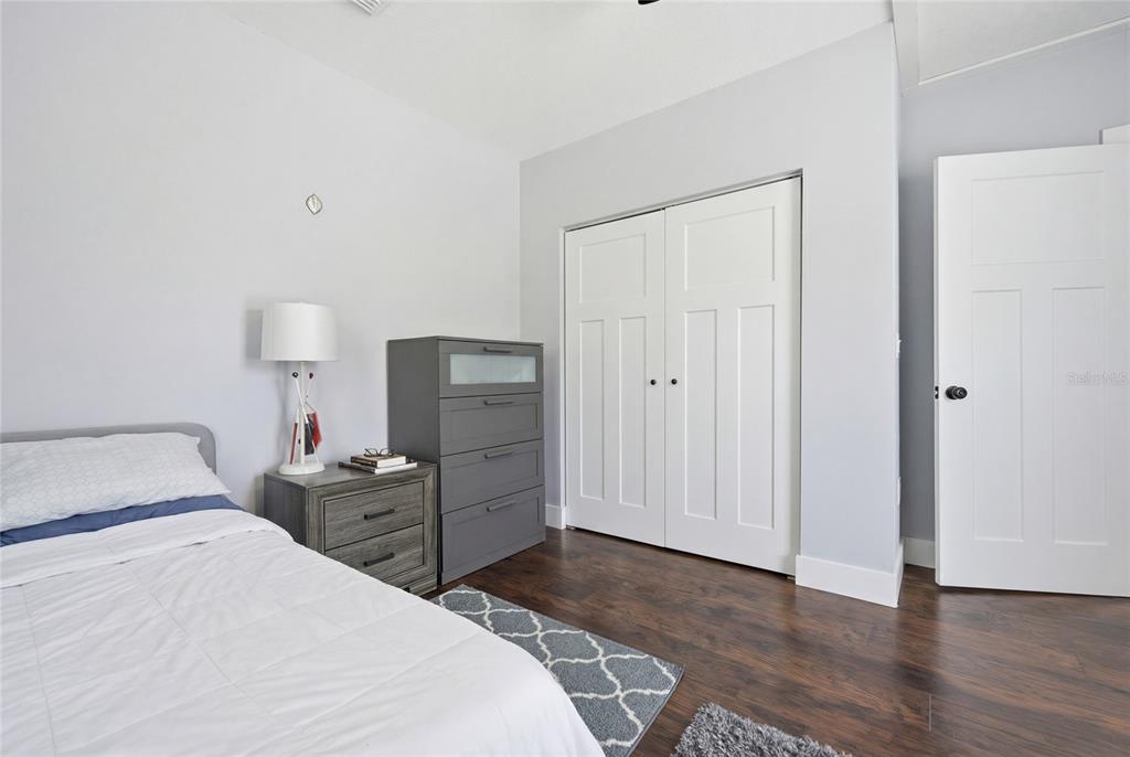 403 Northeast 9th Street Gainesville, FL 32601 - Photo 44 of 62 a bedroom with a bed and a table