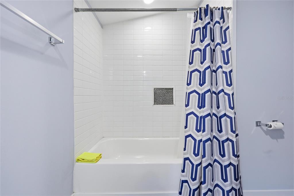403 Northeast 9th Street Gainesville, FL 32601 - Photo 47 of 62 a bathroom with a bathtub and shower