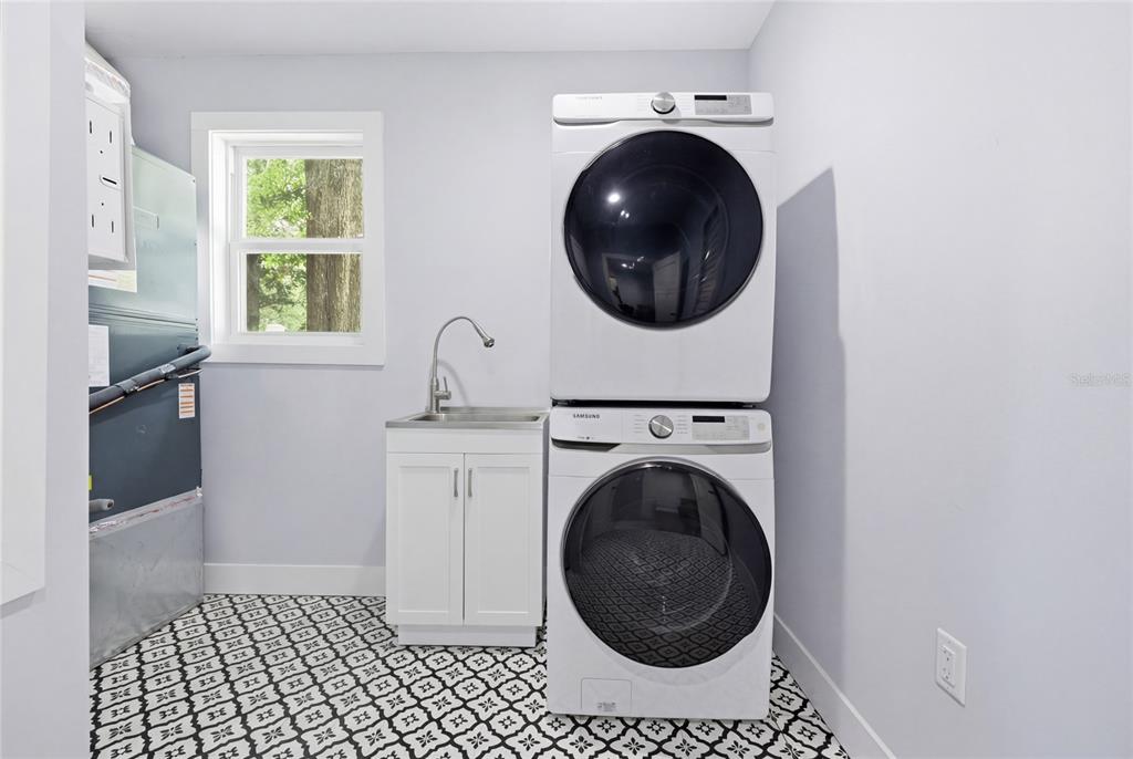 403 Northeast 9th Street Gainesville, FL 32601 - Photo 51 of 62 a view of a hallway with washer and dryer