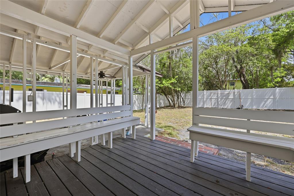 403 Northeast 9th Street Gainesville, FL 32601 - Photo 53 of 62 a view of a patio with a table chairs and wooden floor