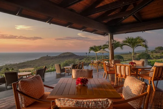 a view of a swimming pool with an outdoor space and seating area