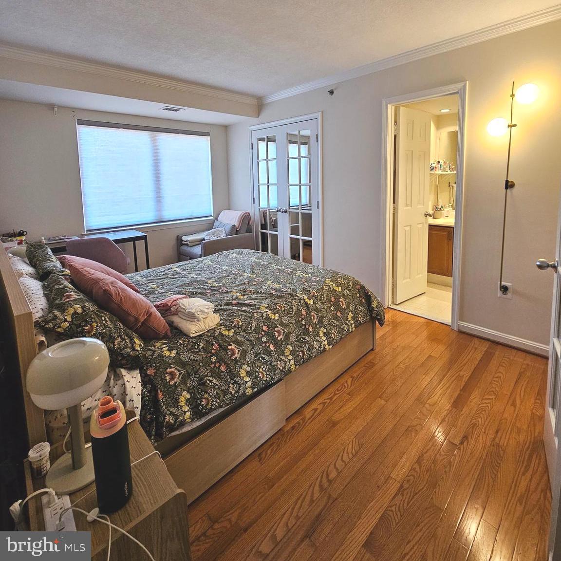 505 East Braddock Road, Unit 608 Alexandria, VA 22314 - Photo 12 of 15 a bedroom with a bed and dresser with mirror