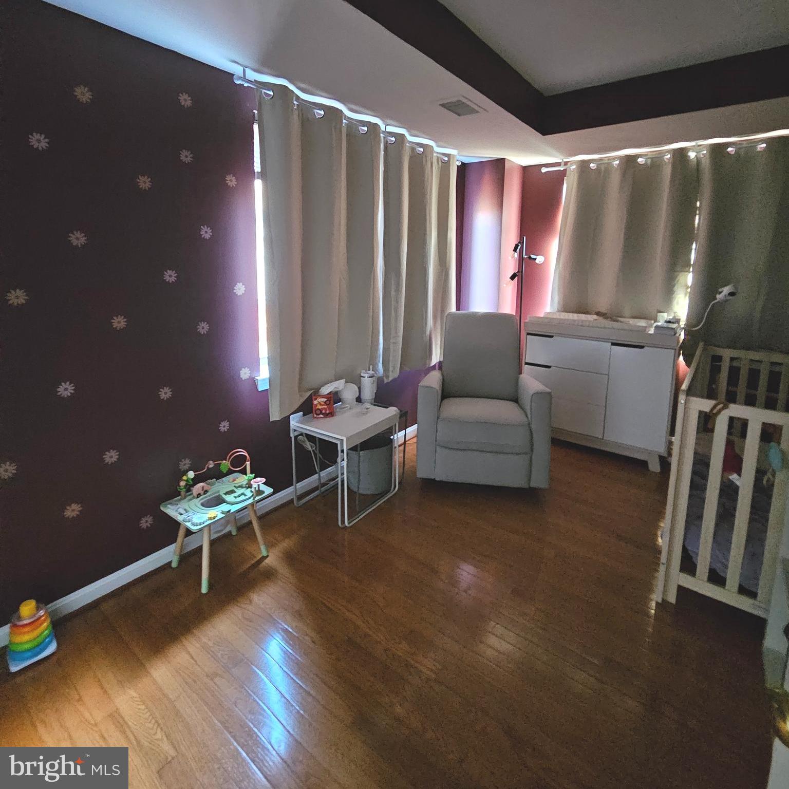 505 East Braddock Road, Unit 608 Alexandria, VA 22314 - Photo 14 of 15 a living room with furniture and a wooden floor
