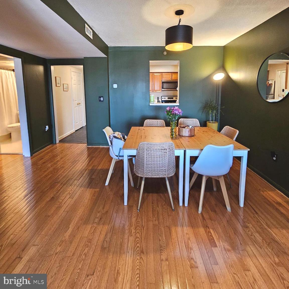 505 East Braddock Road, Unit 608 Alexandria, VA 22314 - Photo 7 of 15 a dining room with furniture and wooden floor