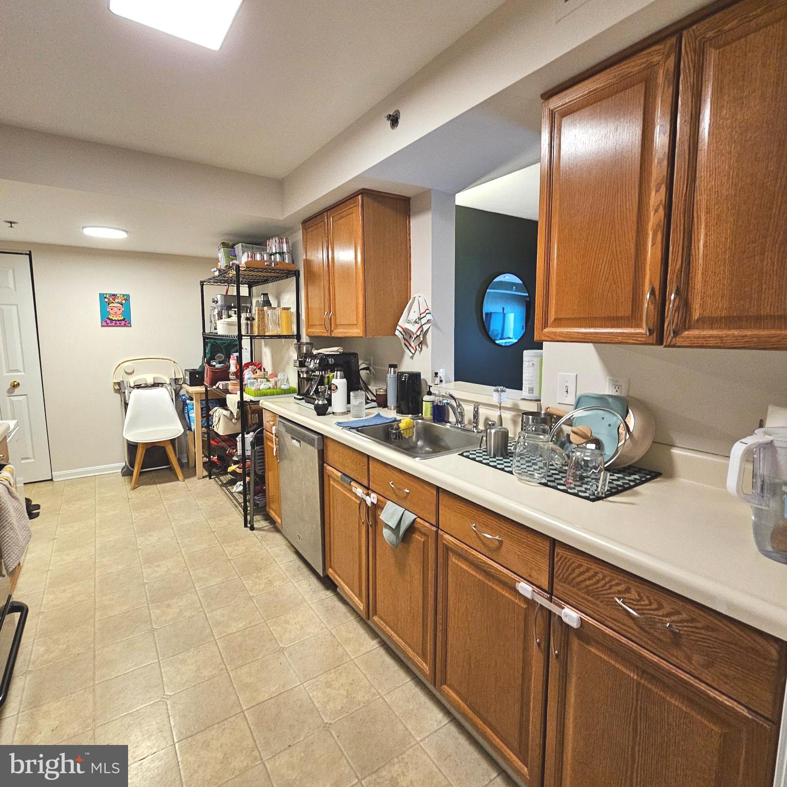 505 East Braddock Road, Unit 608 Alexandria, VA 22314 - Photo 9 of 15 a large white kitchen with a sink and cabinets