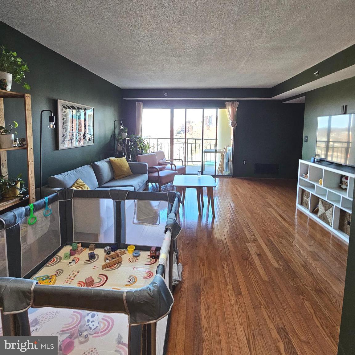 505 East Braddock Road, Unit 608 Alexandria, VA 22314 - Photo 10 of 15 a living room with furniture and wooden floor
