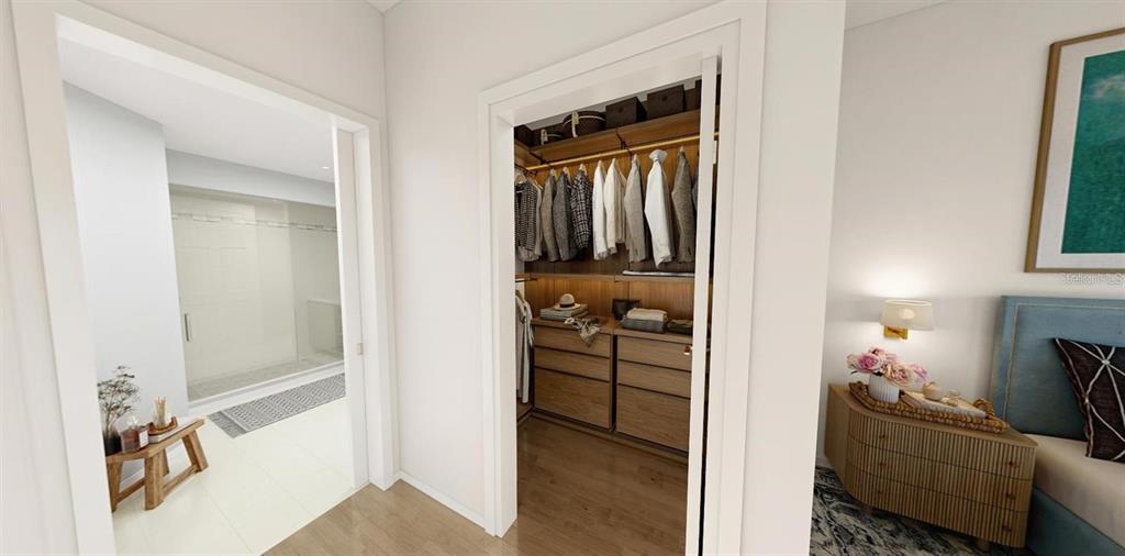 5015 Highway 19, Unit 405 New Port Richey, FL 34652 - Photo 9 of 24 a view of walk in closet with clothes and shoes