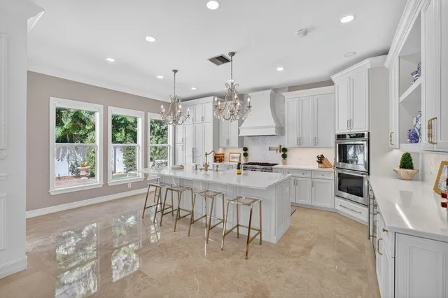a living room with fireplace furniture and a large window