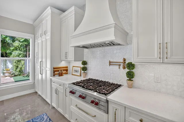 a bathroom with a sink a toilet and shower curtain