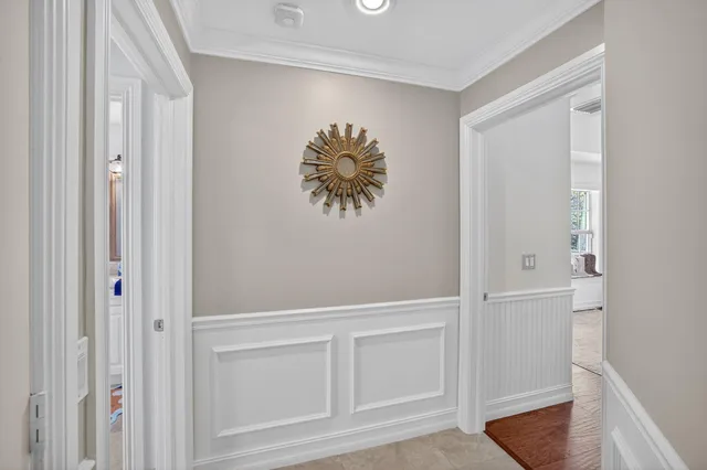 a view of a house with a big yard and potted plants