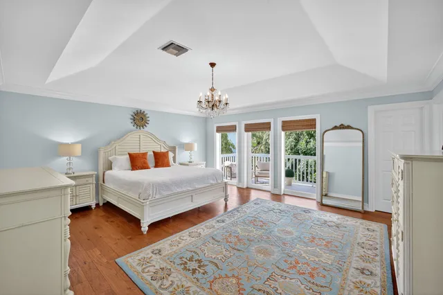 an aerial view of a house with a garden and parking area