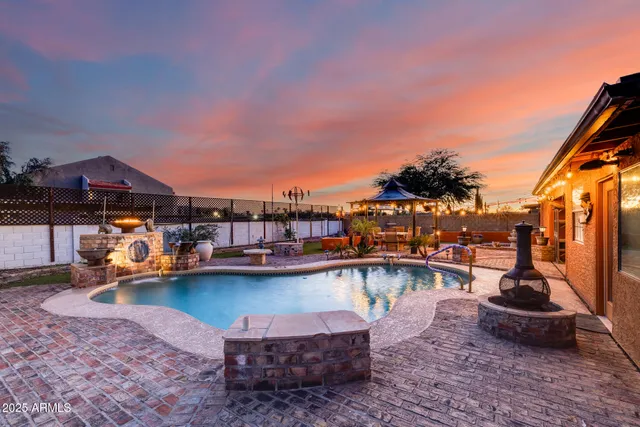 a view of swimming pool with outdoor seating