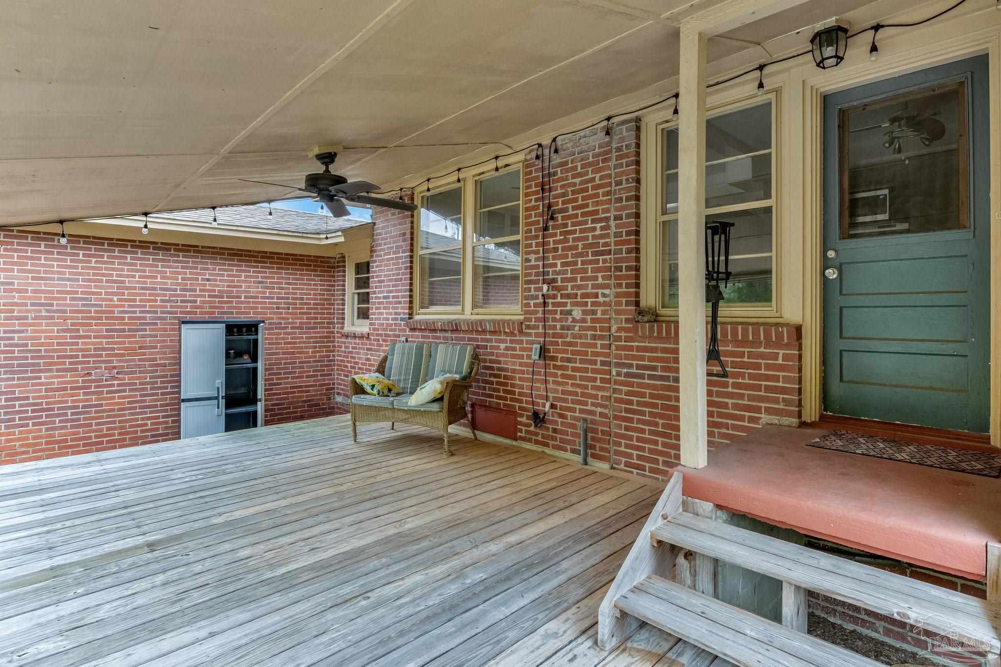 629 Rue Max Street Pensacola, FL 32507 - Photo 23 of 28 a backyard of a house with seating space