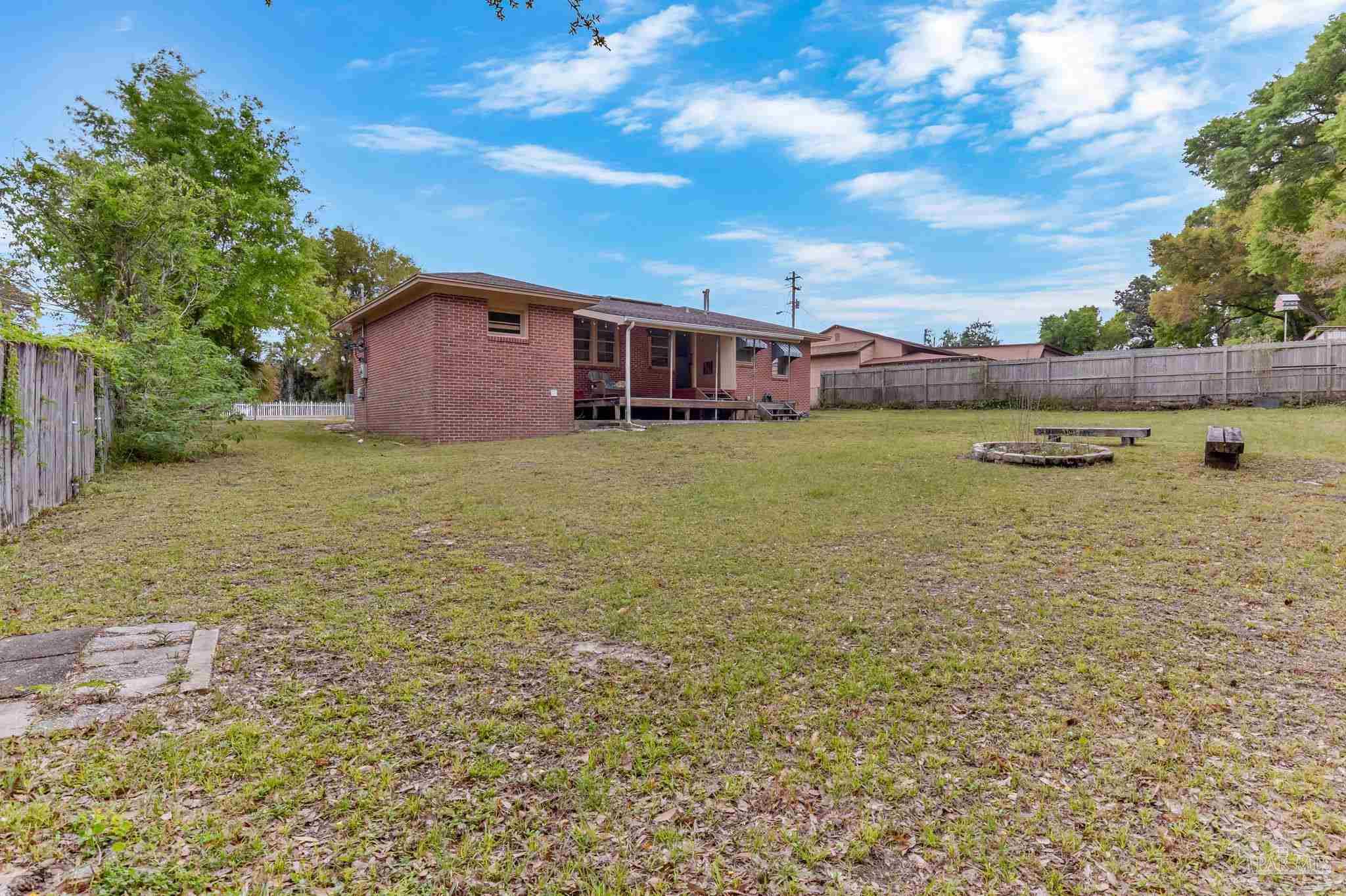 629 Rue Max Street Pensacola, FL 32507 - Photo 26 of 28 a view of a house with a yard
