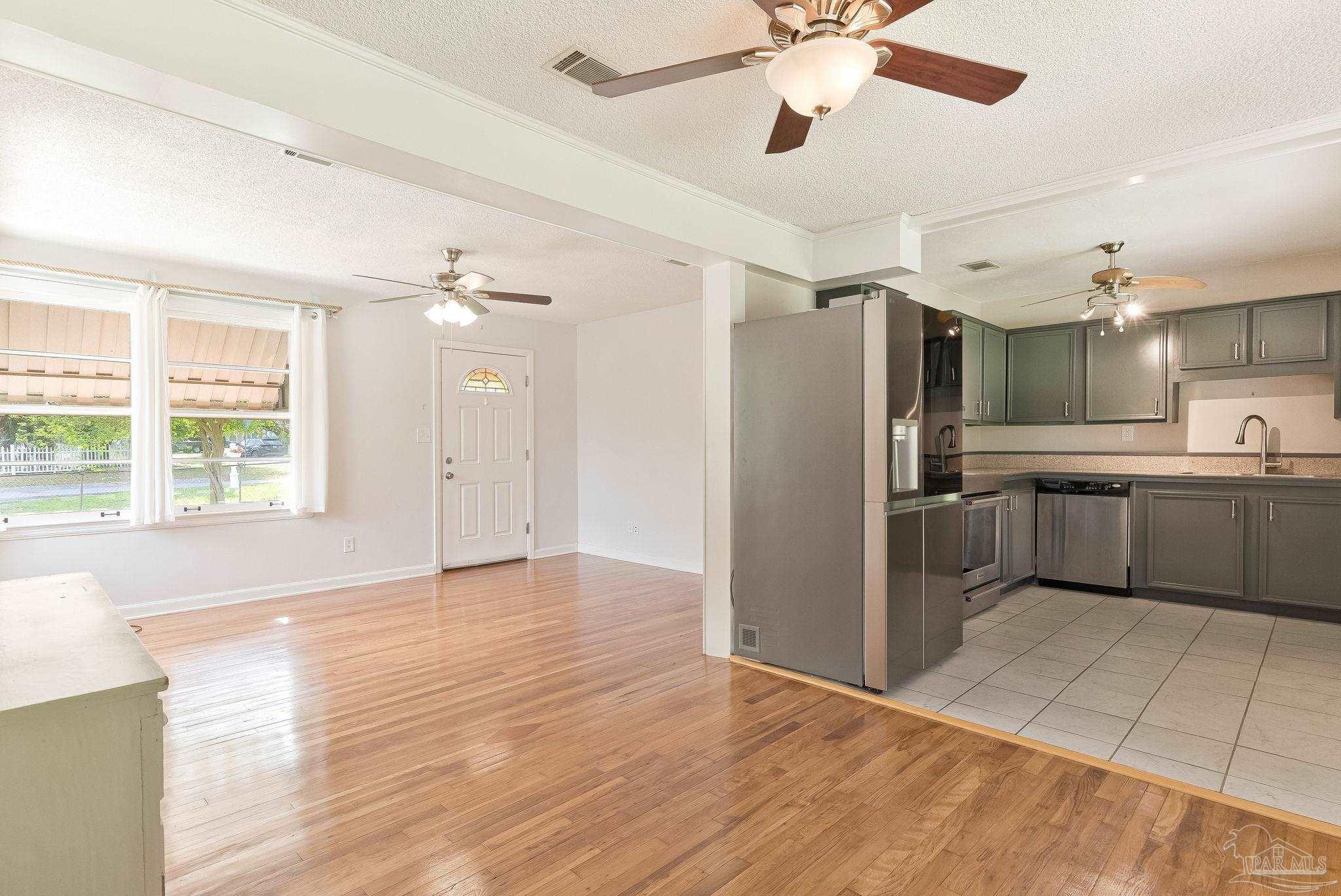 629 Rue Max Street Pensacola, FL 32507 - Photo 4 of 28 a view of a kitchen with a sink and cabinet area