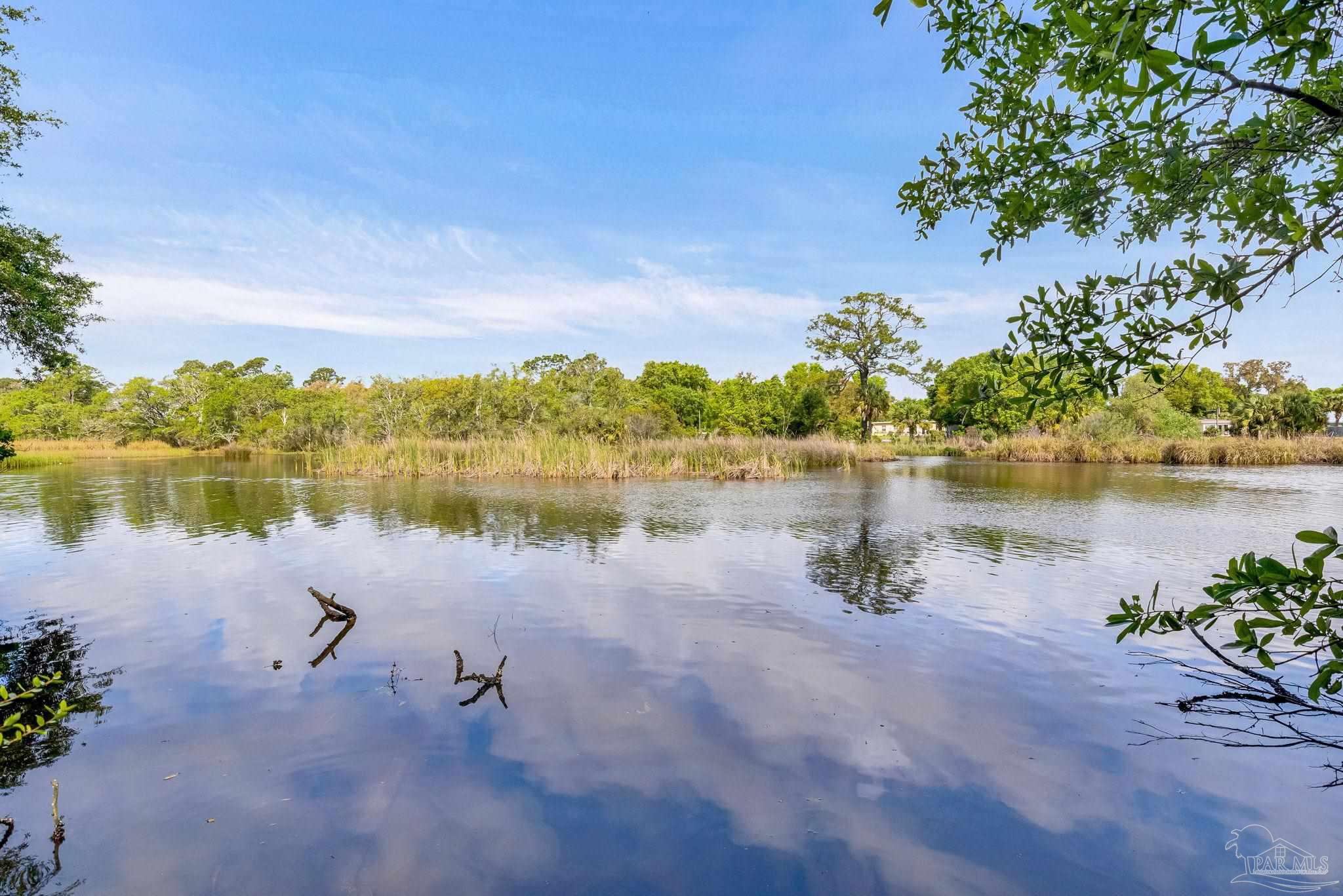 629 Rue Max Street Pensacola, FL 32507 - Photo 7 of 28 a view of a lake with houses in the back