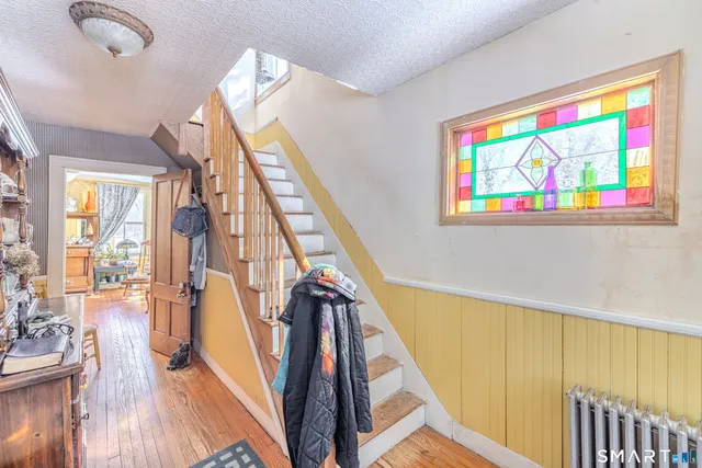 a living room with furniture rug and window