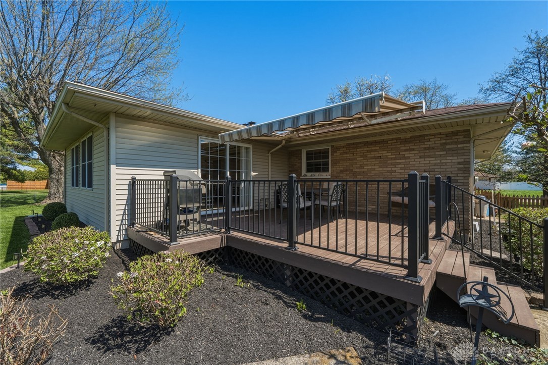 2945 Ashlar Drive Springfield, OH 45503 - Photo 17 of 20 This inviting outdoor space features a spacious composite deck with sunsetter awning perfect for entertaining and relaxation.