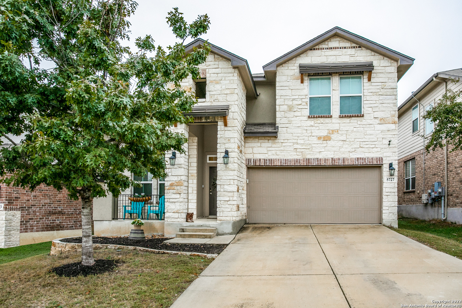5727 Freeport Leaf San Antonio, TX 78253 - Photo 1 of 1 a front view of a house with garden