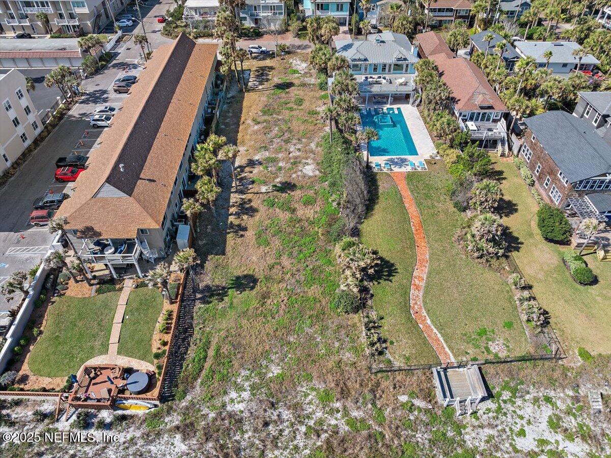 1039 Beach Avenue Atlantic Beach, FL 32233 - Photo 3 of 9 an aerial view of residential houses with outdoor space