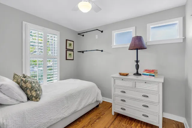 a bedroom with a bed and a night stand