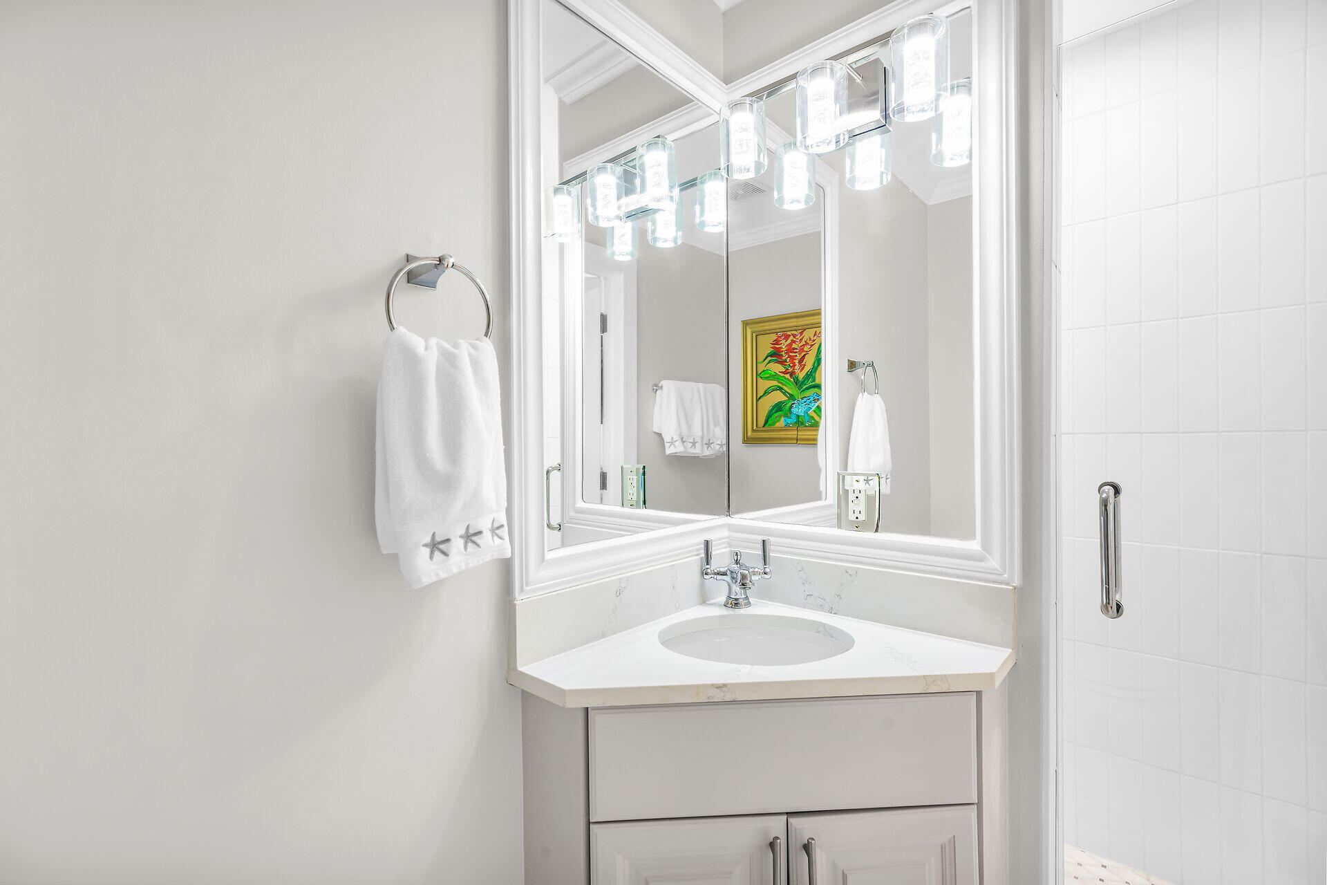 717 Southard Street Key West, FL 33040 - Photo 19 of 36 a bathroom with a sink and a mirror