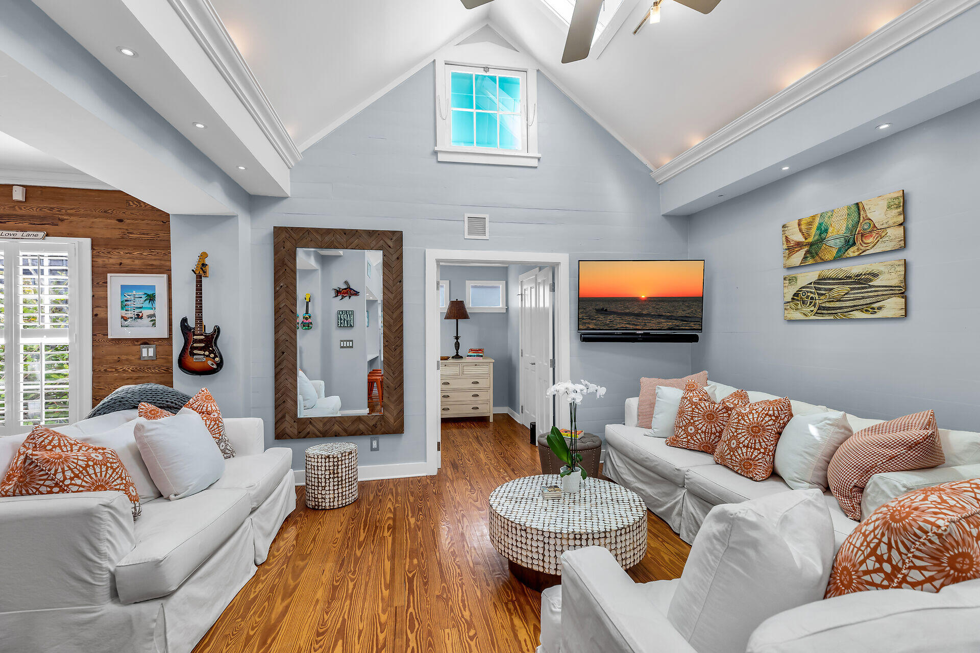 717 Southard Street Key West, FL 33040 - Photo 9 of 36 a living room with furniture and a flat screen tv