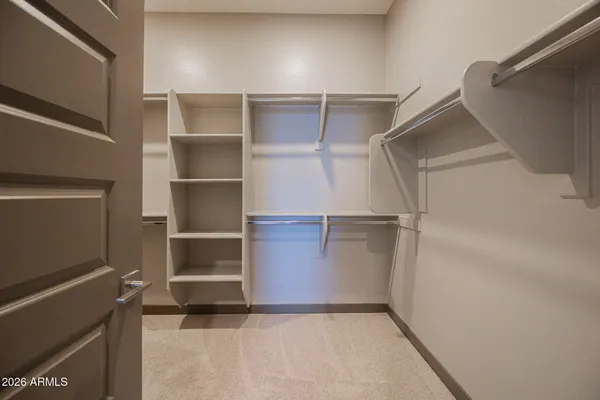 a view of an empty walk in closet