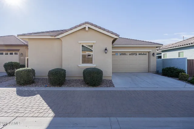 a view of a house with a yard and garage