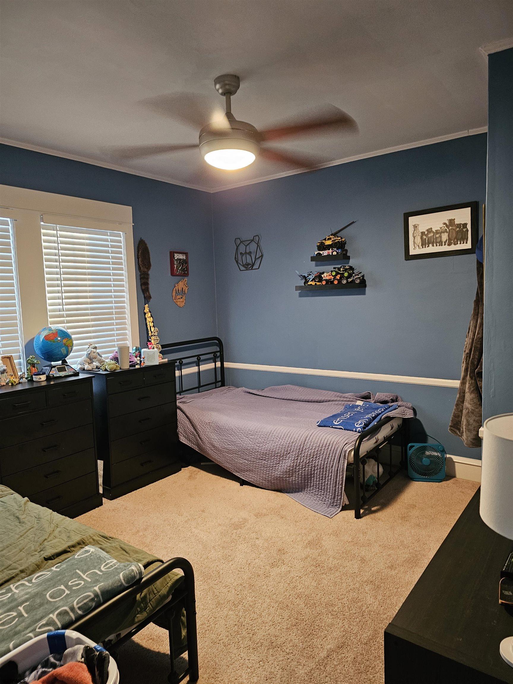 216 Marlin Road Absecon, NJ 08201 - Photo 12 of 20 a bedroom with a bed and wooden floor