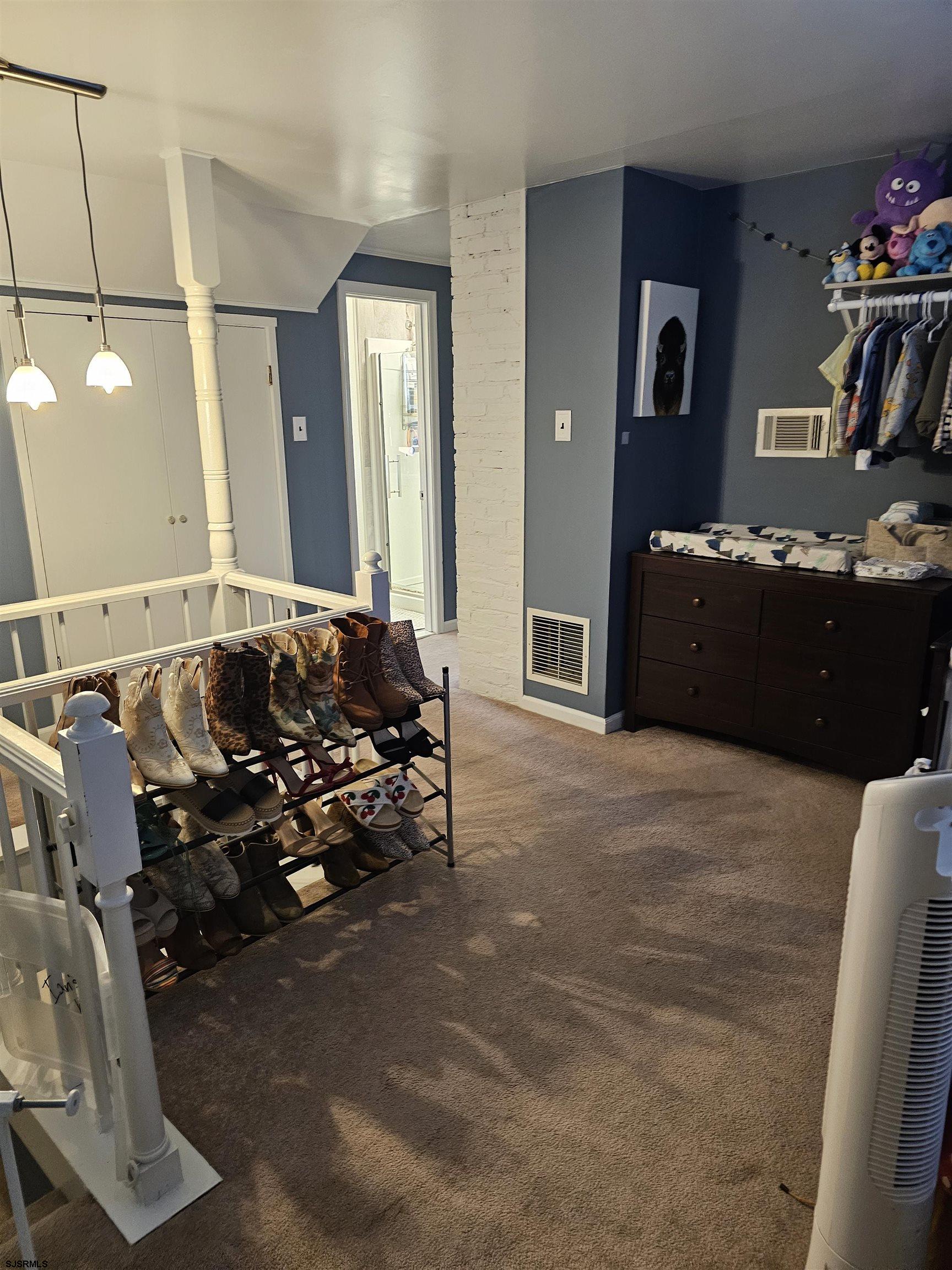 216 Marlin Road Absecon, NJ 08201 - Photo 15 of 20 a living room with furniture gym equipment and a mirror
