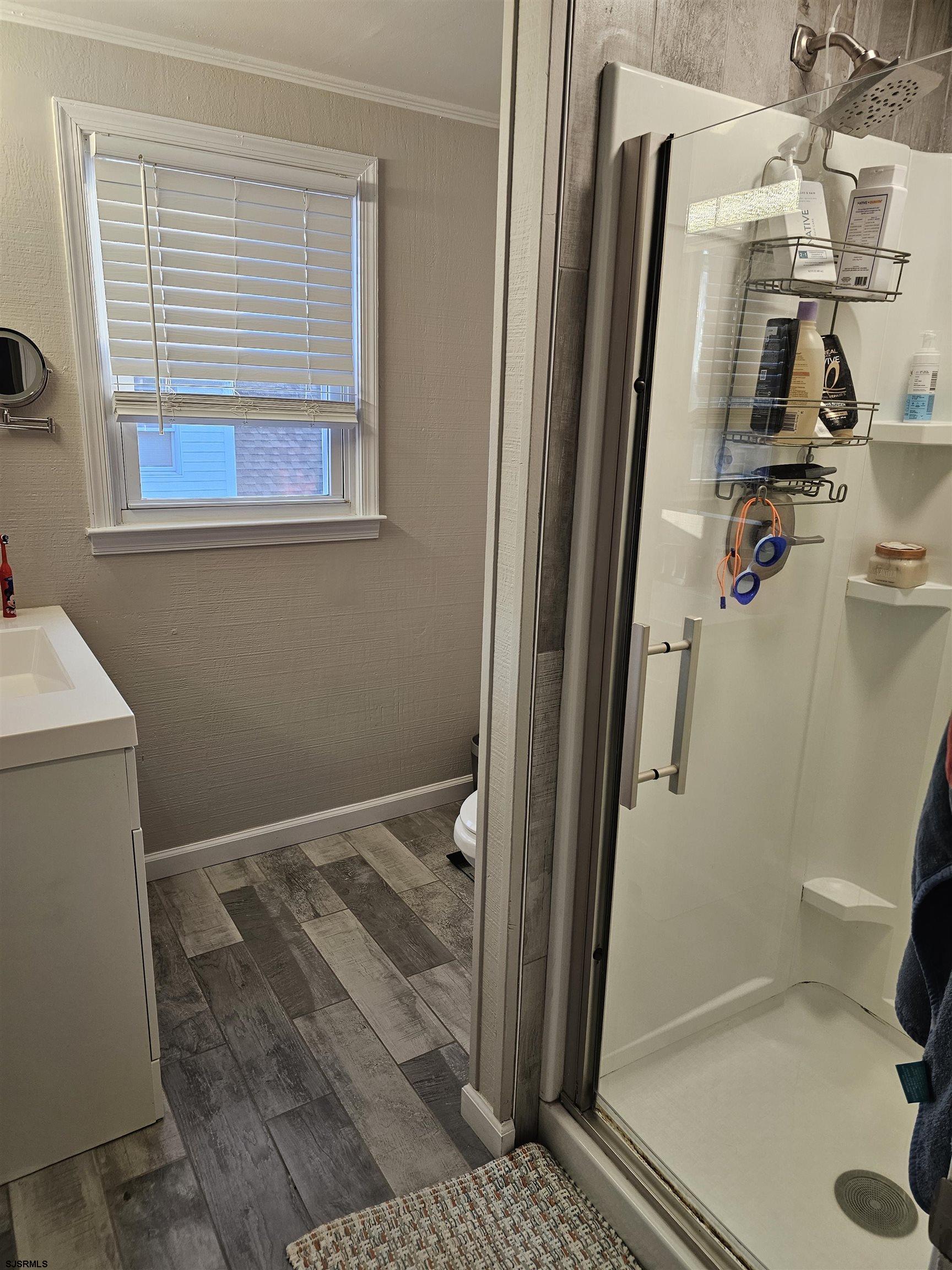 216 Marlin Road Absecon, NJ 08201 - Photo 19 of 20 a bathroom with a sink and a shower