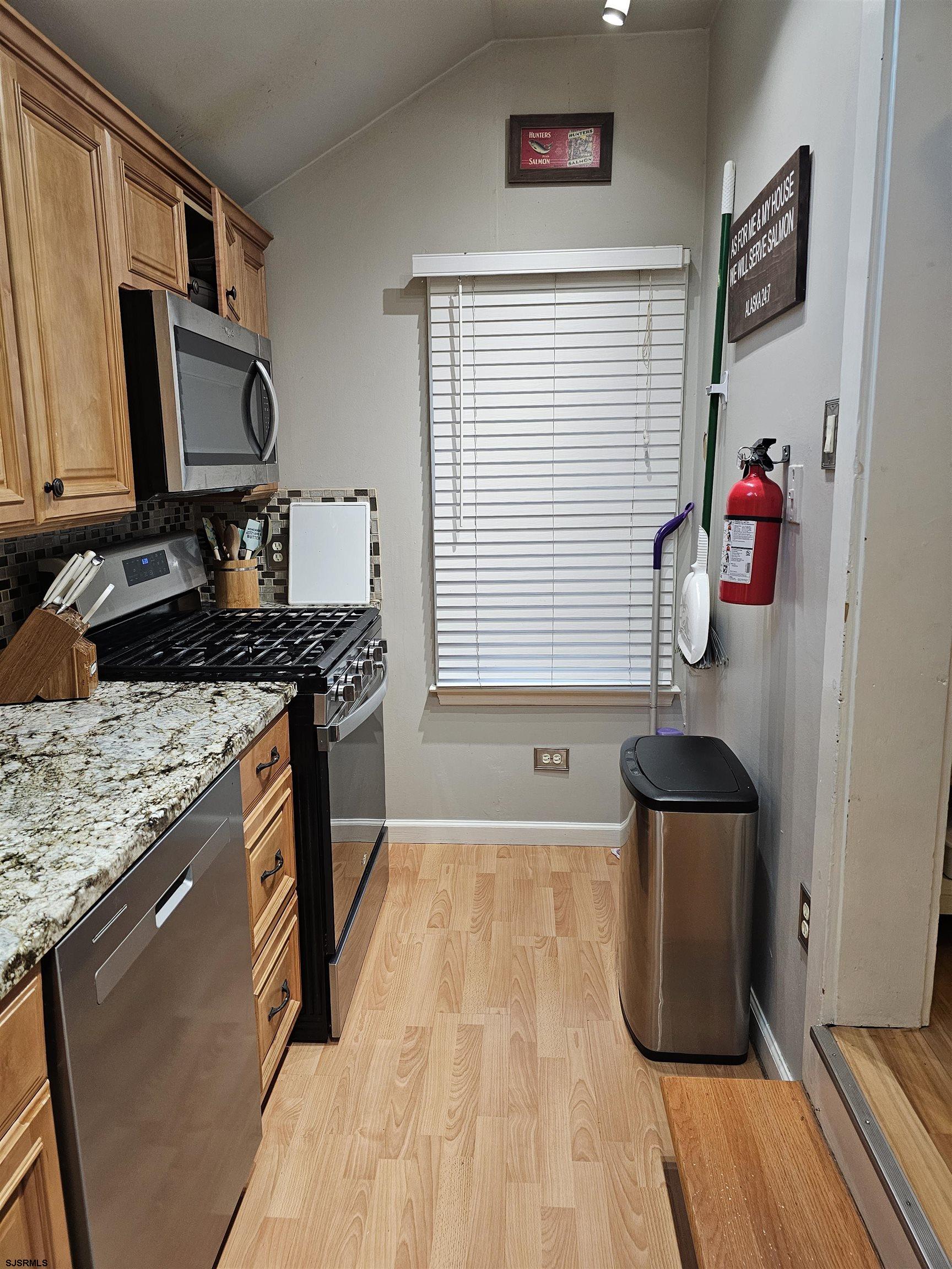 216 Marlin Road Absecon, NJ 08201 - Photo 7 of 20 a kitchen with a sink and a stove top oven