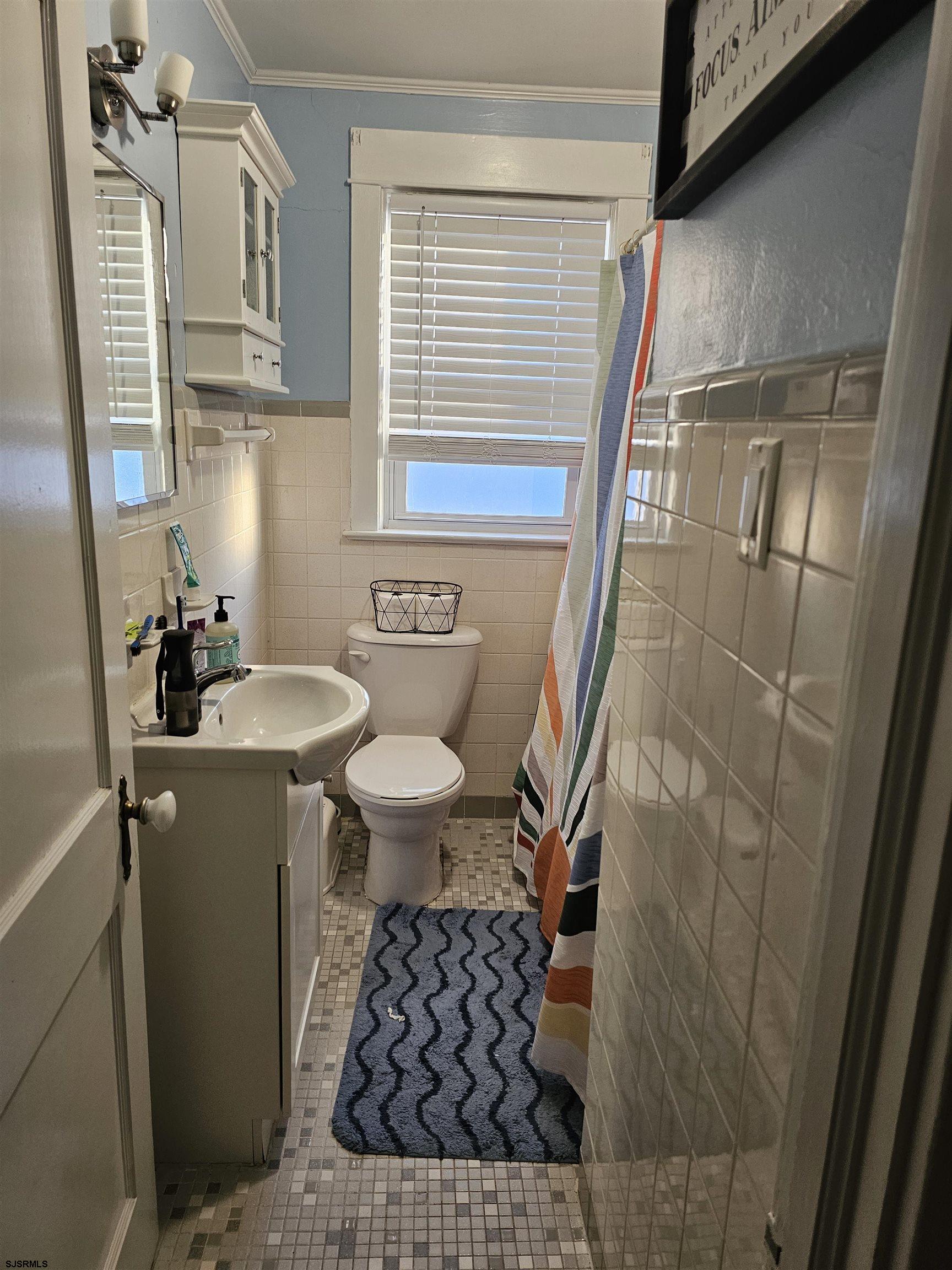 216 Marlin Road Absecon, NJ 08201 - Photo 9 of 20 a bathroom with a sink toilet and shower