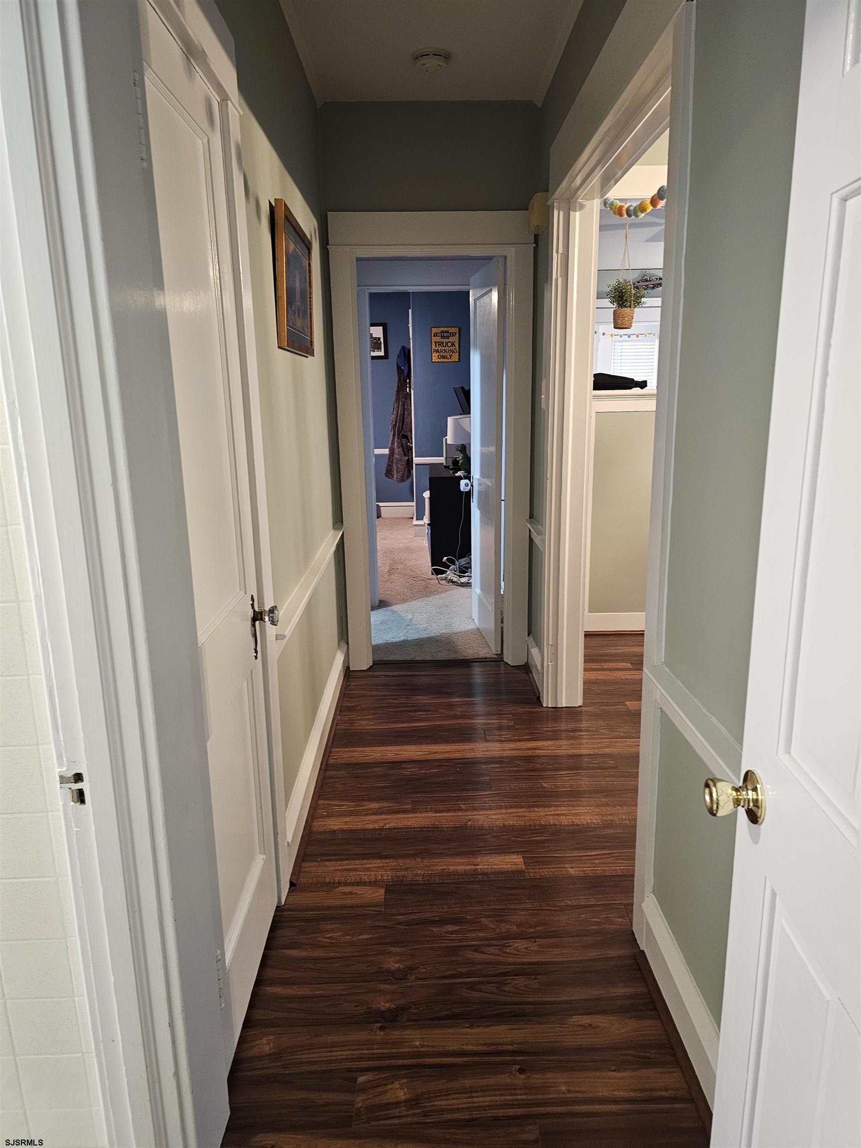 216 Marlin Road Absecon, NJ 08201 - Photo 10 of 20 a view of a hallway with wooden floor and staircase