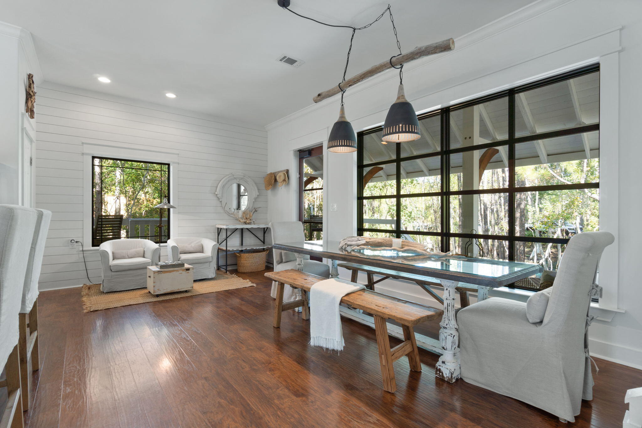 157 Baird Road Santa Rosa Beach, FL 32459 - Photo 14 of 93 a living room with furniture floor to ceiling window and wooden floor