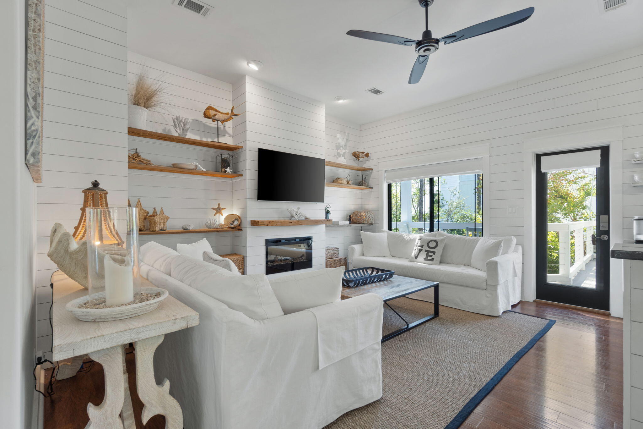 157 Baird Road Santa Rosa Beach, FL 32459 - Photo 17 of 93 a living room with furniture a fireplace and a flat screen tv