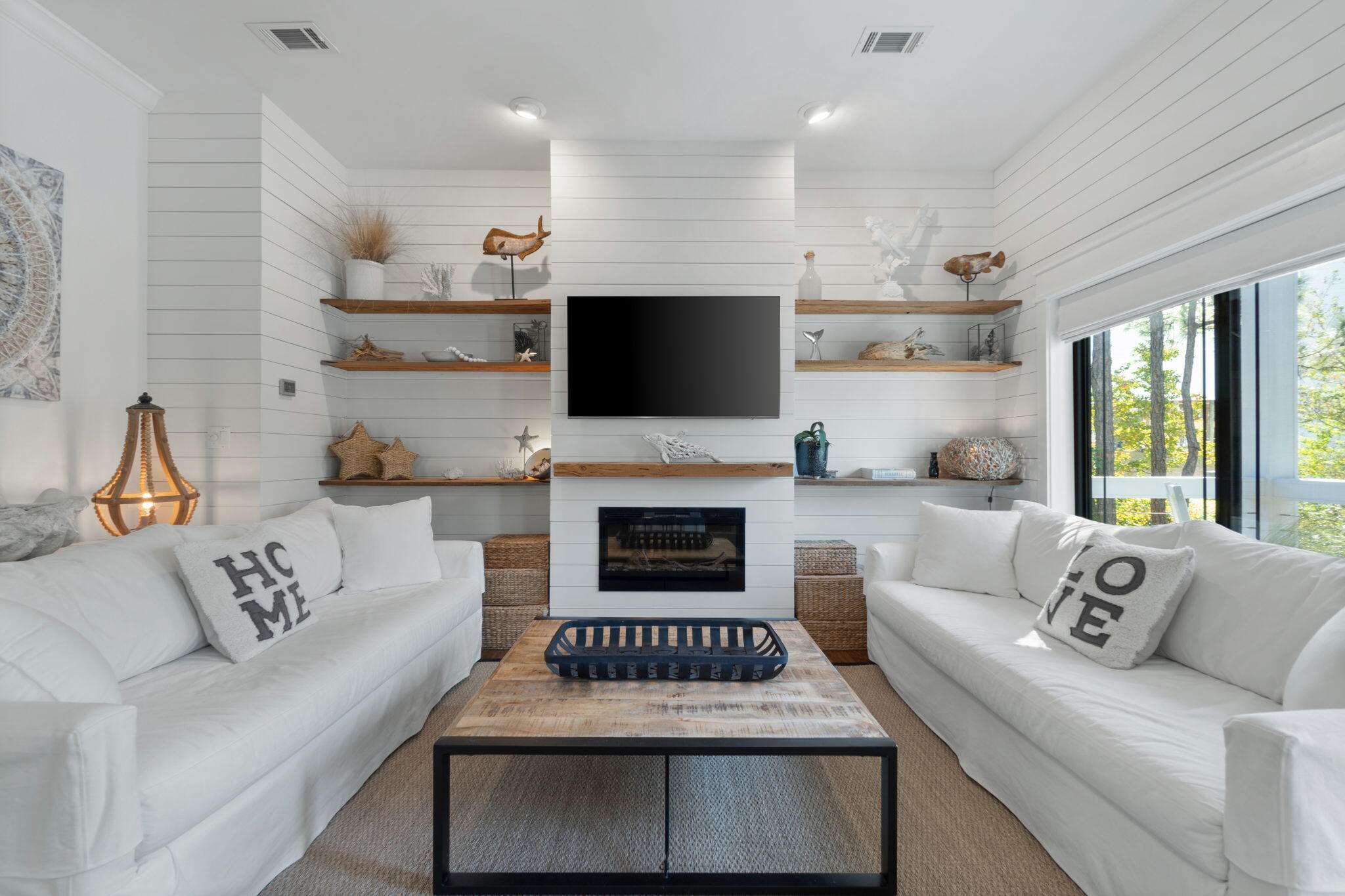 157 Baird Road Santa Rosa Beach, FL 32459 - Photo 19 of 93 a living room with furniture a fireplace and a flat screen tv