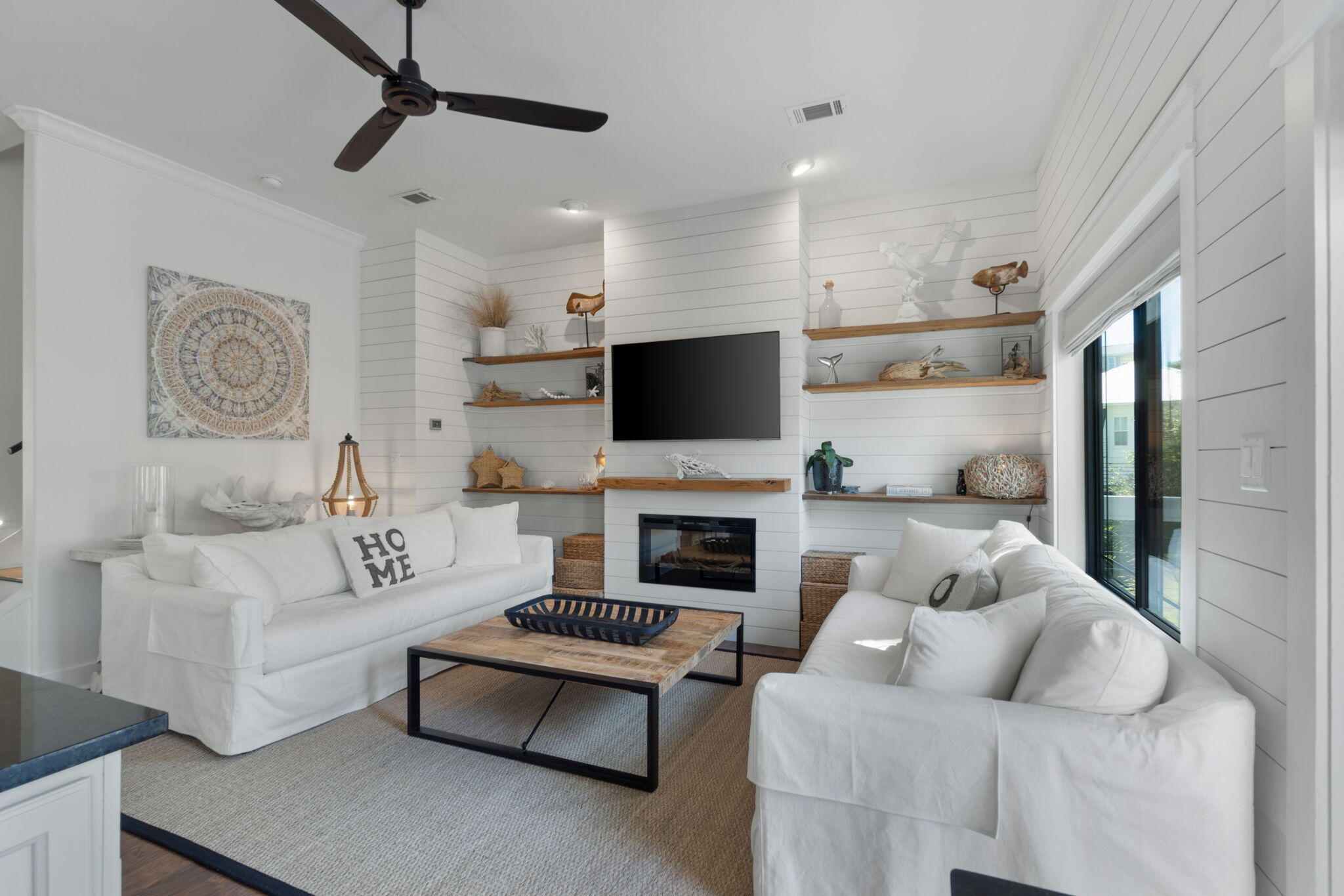 157 Baird Road Santa Rosa Beach, FL 32459 - Photo 20 of 93 a living room with furniture a fireplace and a flat screen tv