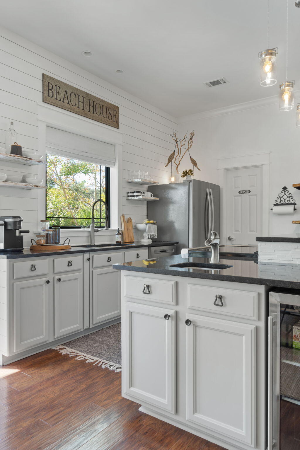 157 Baird Road Santa Rosa Beach, FL 32459 - Photo 25 of 93 a kitchen with granite countertop white cabinets and a window