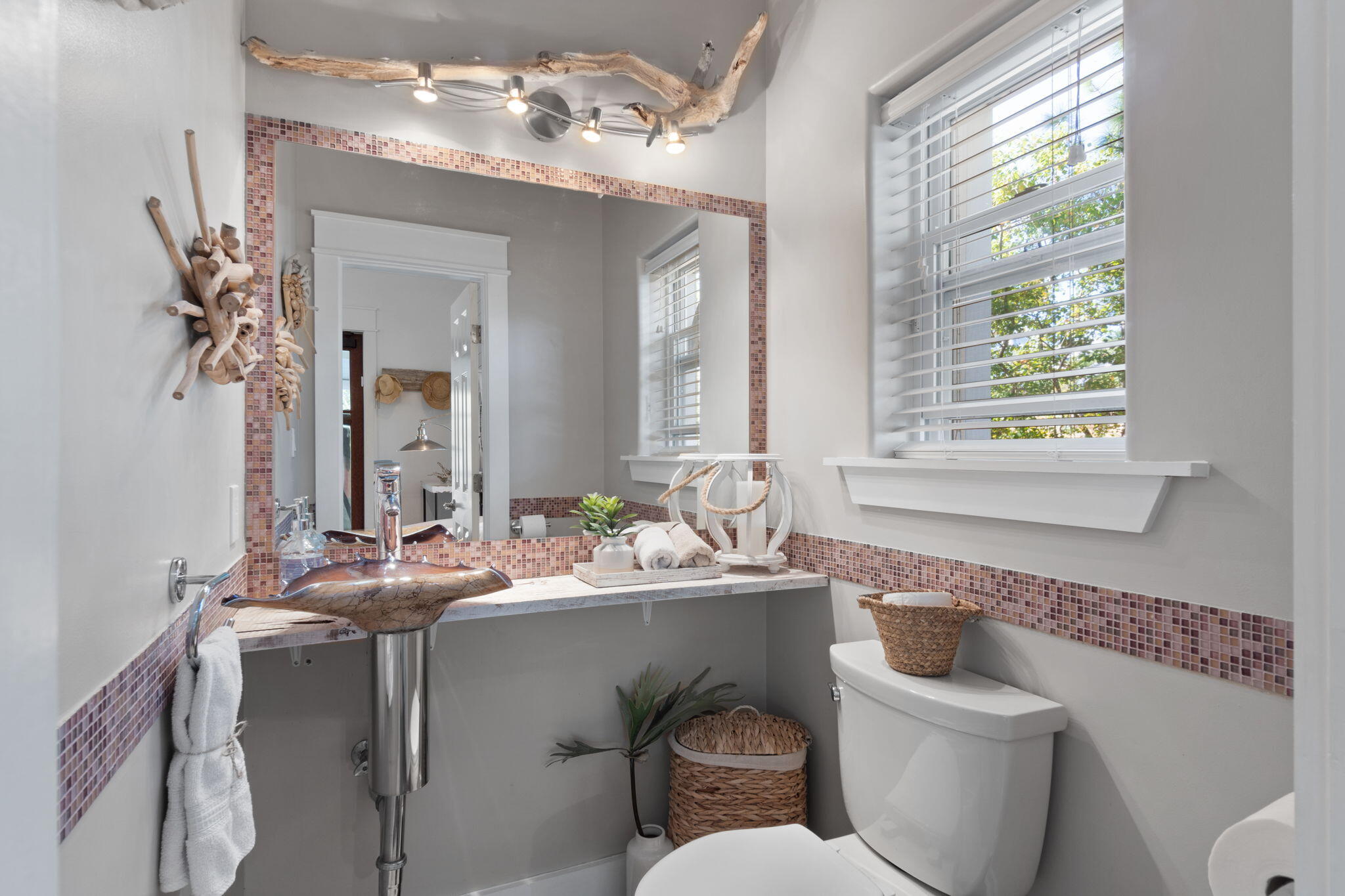 157 Baird Road Santa Rosa Beach, FL 32459 - Photo 29 of 93 a bathroom with a granite countertop toilet sink and mirror