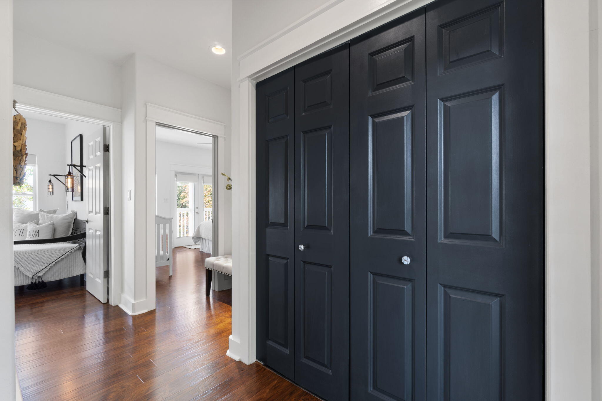 157 Baird Road Santa Rosa Beach, FL 32459 - Photo 31 of 93 a view of a hallway with wooden floor and a cabinet