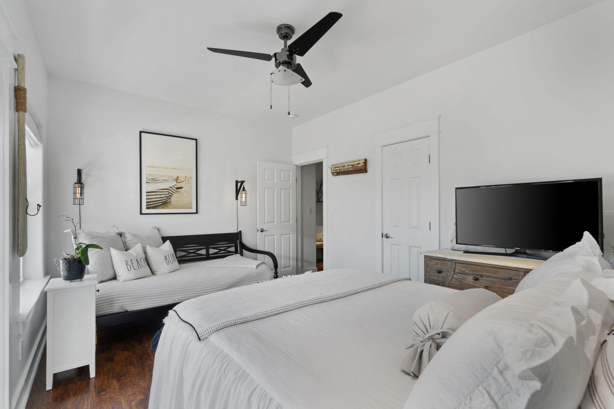 157 Baird Road Santa Rosa Beach, FL 32459 - Photo 38 of 93 a bedroom with a bed and a flat screen tv