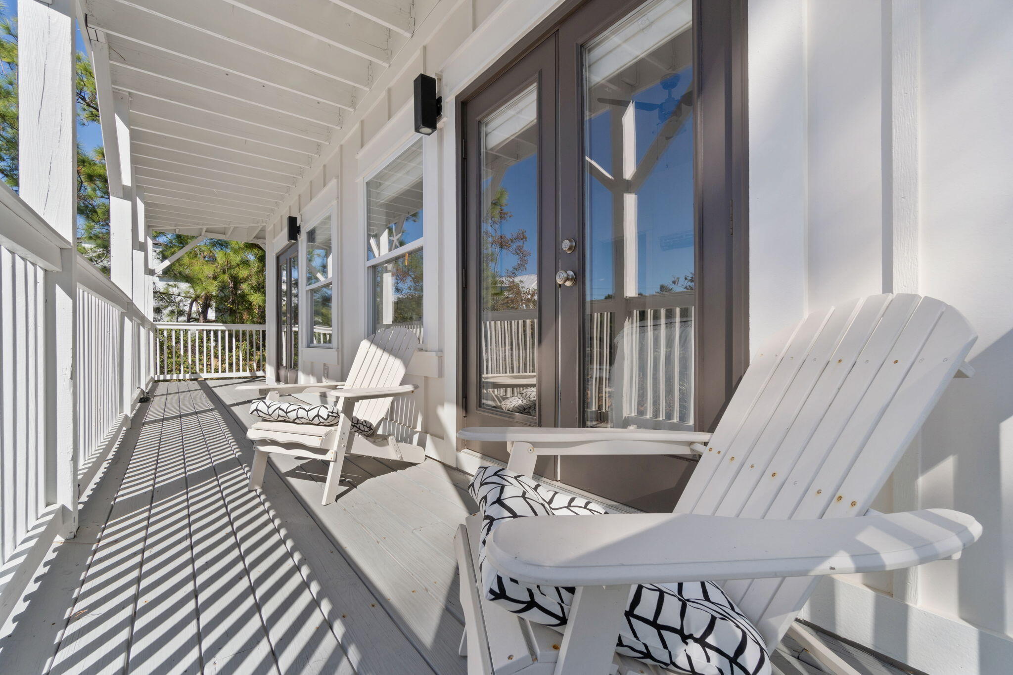 157 Baird Road Santa Rosa Beach, FL 32459 - Photo 41 of 93 a view of a patio with couches table and chairs and potted plants