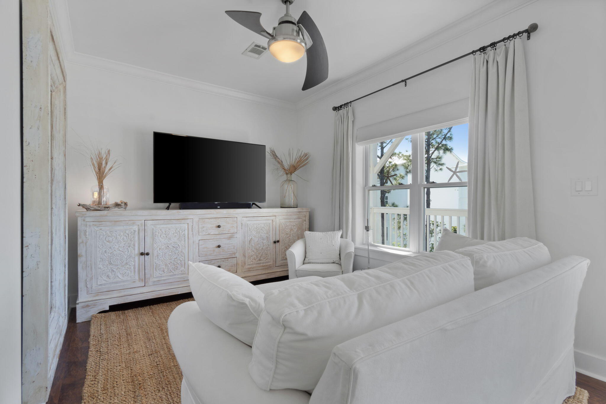 157 Baird Road Santa Rosa Beach, FL 32459 - Photo 50 of 93 a living room with furniture and a flat screen tv